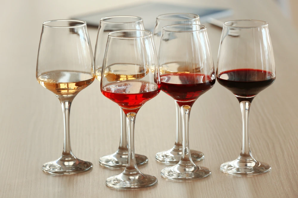 Different wines line up on a table